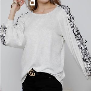 Oatmeal shirt with snakeskin sleeves